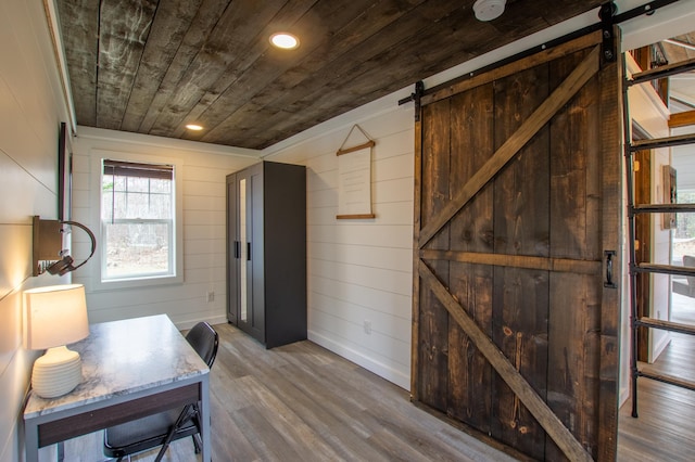 29133 Neighborly Dr, Laporte, MN 56461 - entryway with a barn door, wooden ceiling, wood finished floors, wood walls, and recessed lighting