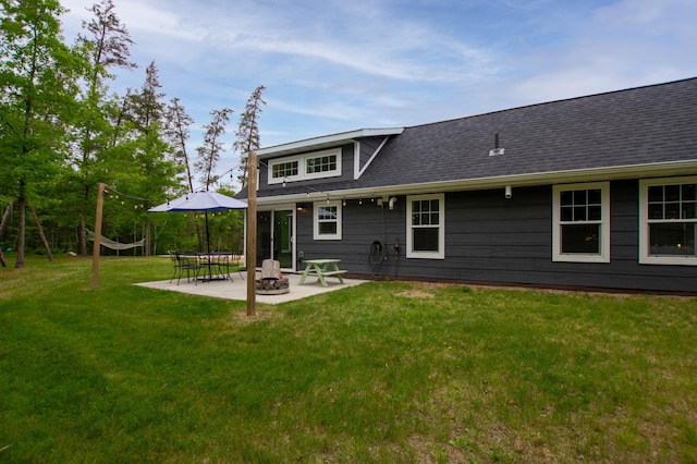 29133 Neighborly Dr, Laporte, MN 56461 - back of property featuring a patio, a yard, an outdoor fire pit, and roof with shingles