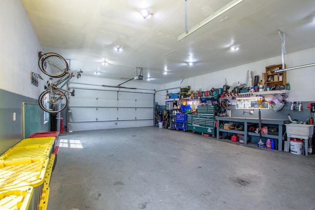 29133 Neighborly Dr, Laporte, MN 56461 - garage with a garage door opener and a workshop area