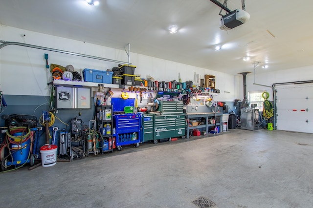 29133 Neighborly Dr, Laporte, MN 56461 - garage featuring a garage door opener and a workshop area
