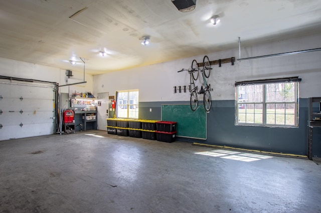 29133 Neighborly Dr, Laporte, MN 56461 - garage with a garage door opener and a workshop area