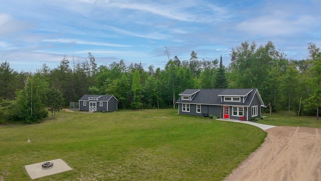 29133 Neighborly Dr, Laporte, MN 56461 - traditional-style home with dirt driveway, an outdoor structure, a front yard, and a wooded view