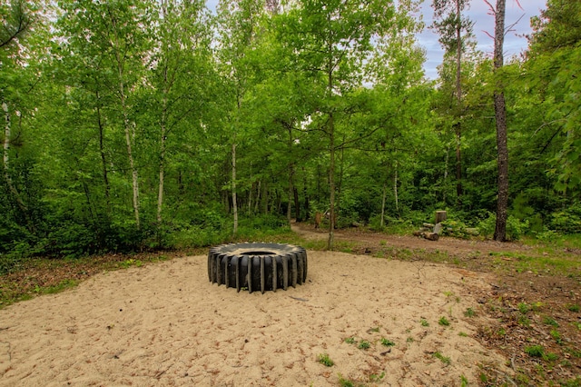 29133 Neighborly Dr, Laporte, MN 56461 - view of yard featuring an outdoor fire pit and a forest view