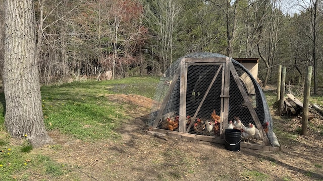 view of poultry coop with a view of trees