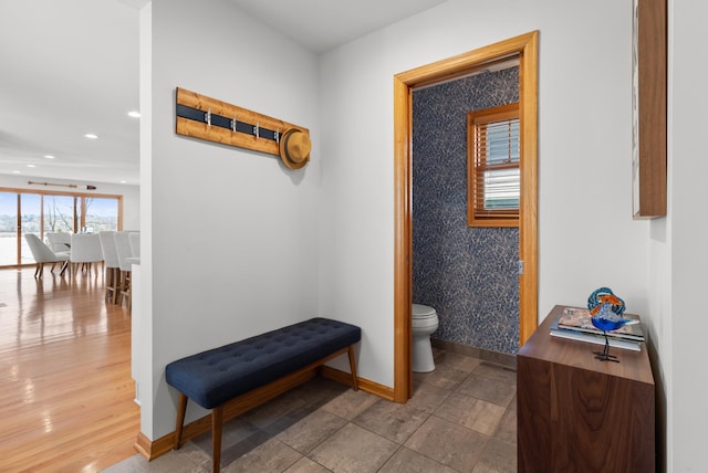 corridor with baseboards and recessed lighting