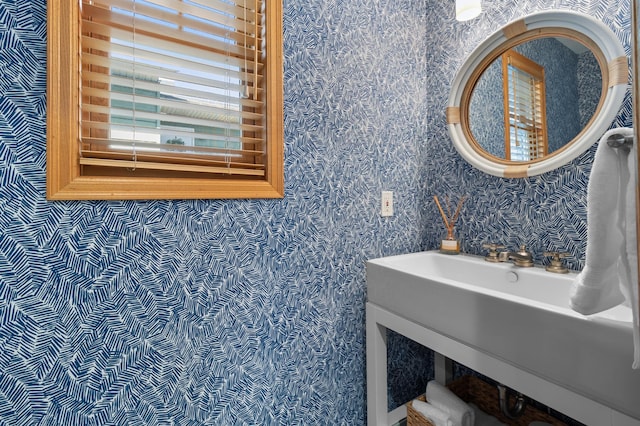 bathroom featuring wallpapered walls