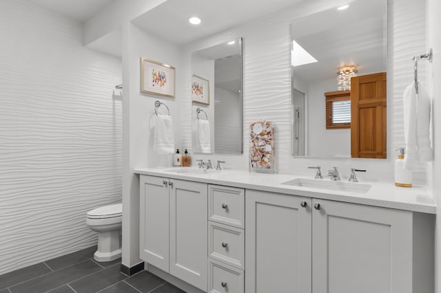 full bathroom featuring tile patterned floors, double vanity, and toilet