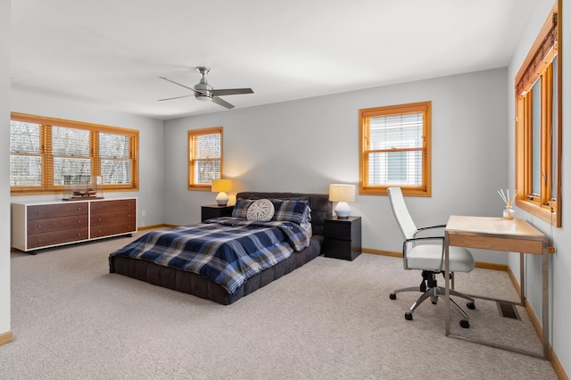 bedroom with carpet flooring, a desk, baseboards, and ceiling fan