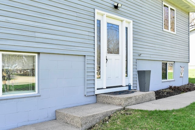 property entrance with concrete block siding