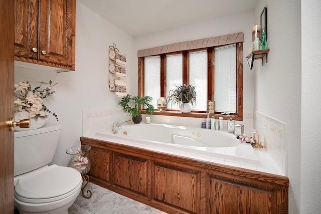 full bathroom featuring toilet and a bath