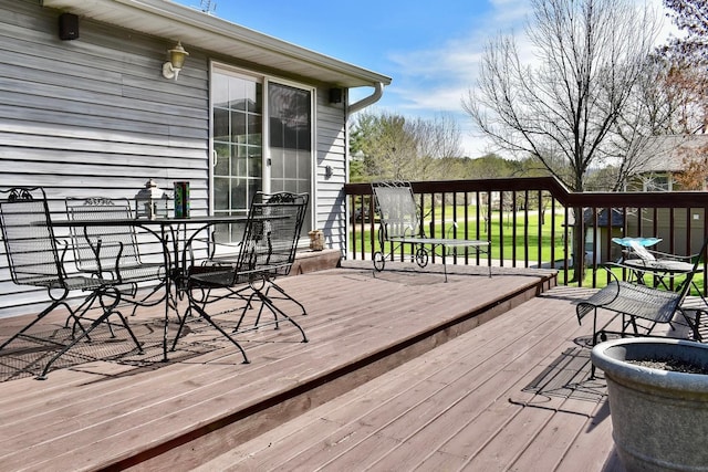 wooden deck with outdoor dining area