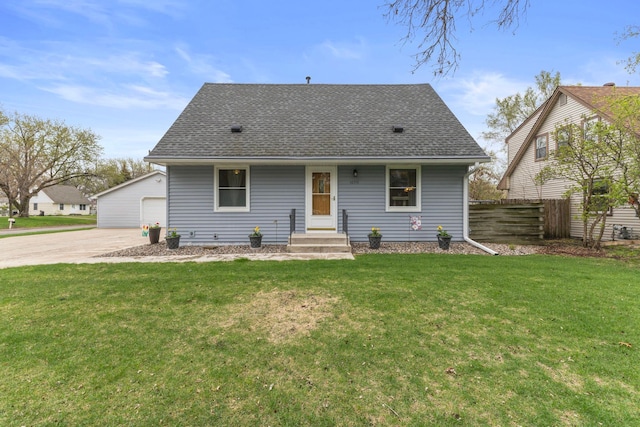 10851 Olive St NW, Coon Rapids, MN 55448 - rear view of house with roof with shingles, a garage, and an outdoor structure