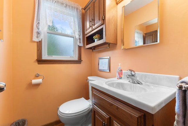 10851 Olive St NW, Coon Rapids, MN 55448 - half bathroom featuring vanity and toilet