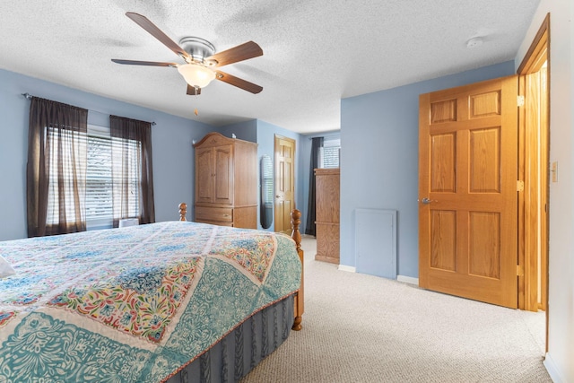 10851 Olive St NW, Coon Rapids, MN 55448 - bedroom featuring carpet, a textured ceiling, baseboards, and ceiling fan