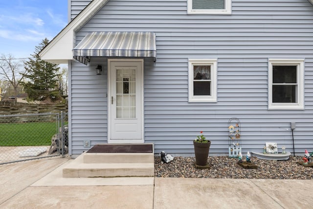 10851 Olive St NW, Coon Rapids, MN 55448 - doorway to property featuring metal roof and a standing seam roof