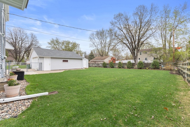 10851 Olive St NW, Coon Rapids, MN 55448 - view of yard featuring an outdoor structure, central air condition unit, and a garage