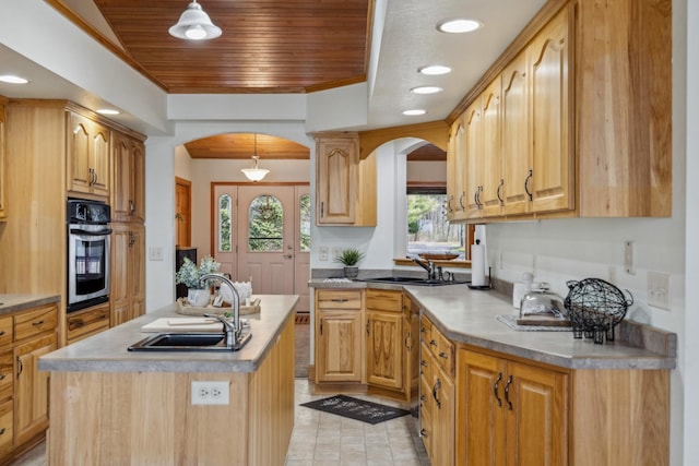 5301 Pine Beach Rd, Brainerd, MN 56401 - kitchen with arched walkways, stainless steel appliances, a sink, plenty of natural light, and wood ceiling