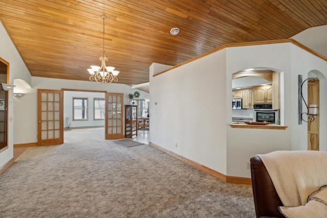 5301 Pine Beach Rd, Brainerd, MN 56401 - living room with wood ceiling, carpet flooring, lofted ceiling, baseboards, and a chandelier