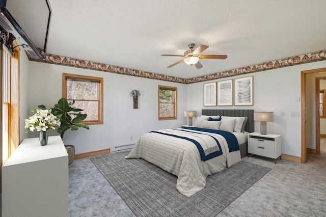5301 Pine Beach Rd, Brainerd, MN 56401 - bedroom featuring a baseboard radiator, light carpet, baseboards, a textured ceiling, and ceiling fan