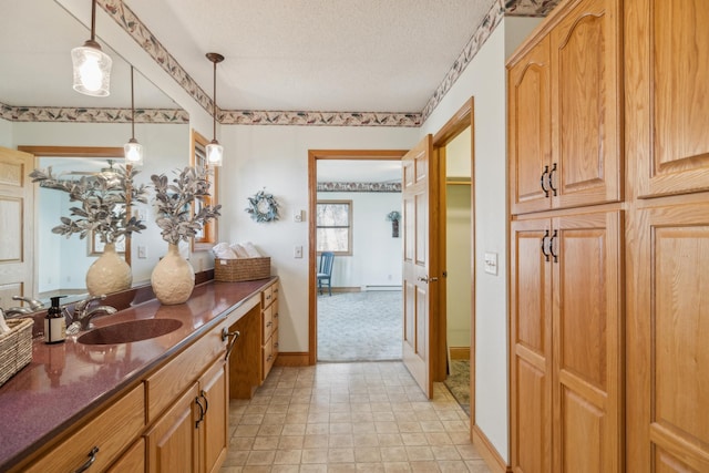5301 Pine Beach Rd, Brainerd, MN 56401 - bathroom featuring vanity, a textured ceiling, and baseboards
