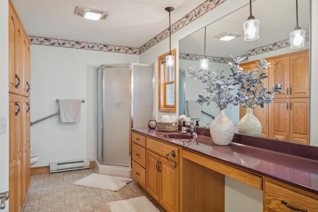 5301 Pine Beach Rd, Brainerd, MN 56401 - full bath featuring a baseboard heating unit, a stall shower, vanity, and toilet
