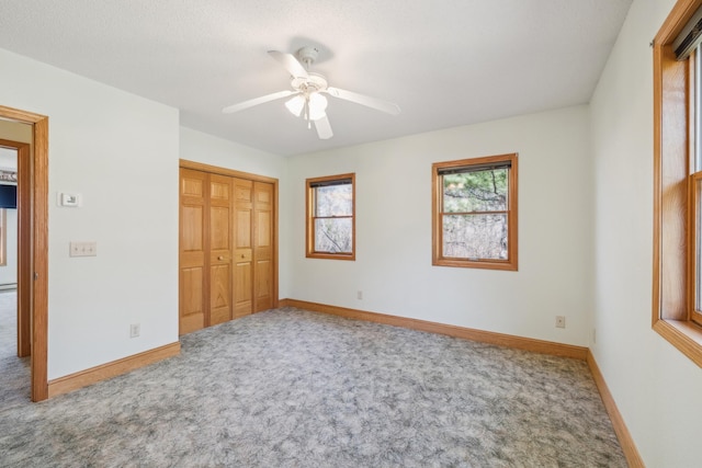 5301 Pine Beach Rd, Brainerd, MN 56401 - unfurnished bedroom with carpet floors, baseboards, a closet, and ceiling fan
