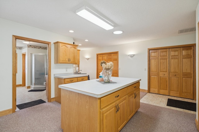 5301 Pine Beach Rd, Brainerd, MN 56401 - kitchen featuring light colored carpet, light countertops, a kitchen island, recessed lighting, and baseboards