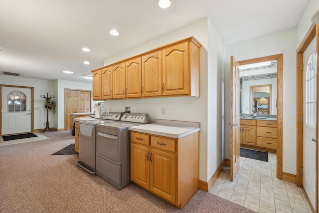 5301 Pine Beach Rd, Brainerd, MN 56401 - kitchen featuring washing machine and clothes dryer, recessed lighting, baseboards, and light countertops