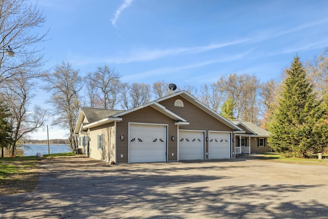 5301 Pine Beach Rd, Brainerd, MN 56401 - view of home's exterior with a water view and a shingled roof