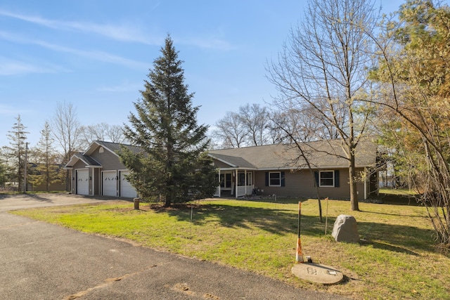 5301 Pine Beach Rd, Brainerd, MN 56401 - ranch-style home with a front lawn, concrete driveway, an attached garage, and a shingled roof