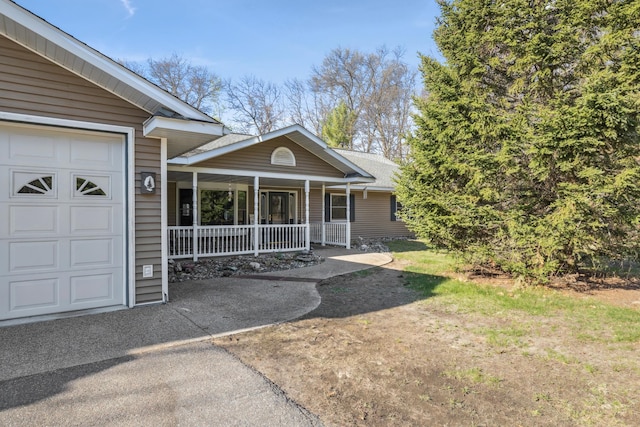 5301 Pine Beach Rd, Brainerd, MN 56401 - entrance to property with a porch and a garage