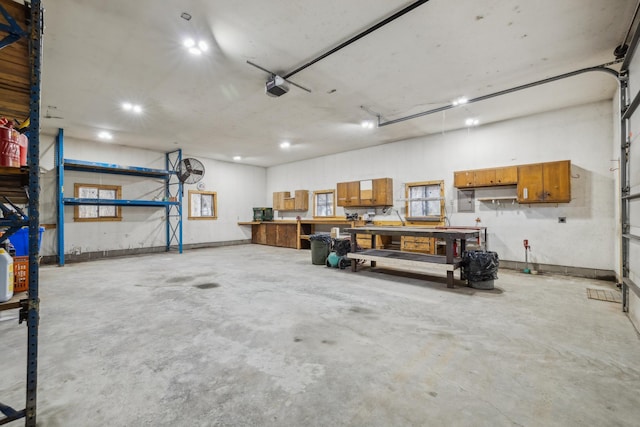 5301 Pine Beach Rd, Brainerd, MN 56401 - garage with a garage door opener and a workshop area