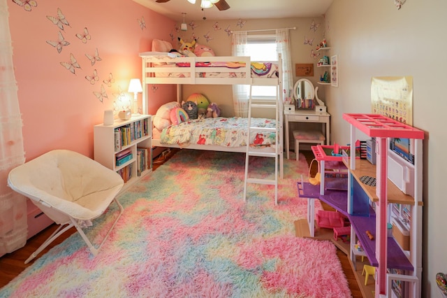 bedroom with ceiling fan and wood finished floors