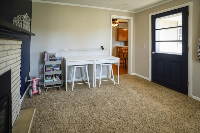 interior space with crown molding, a ceiling fan, baseboards, and a brick fireplace
