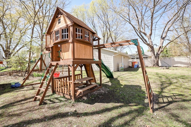 view of play area featuring a lawn and fence