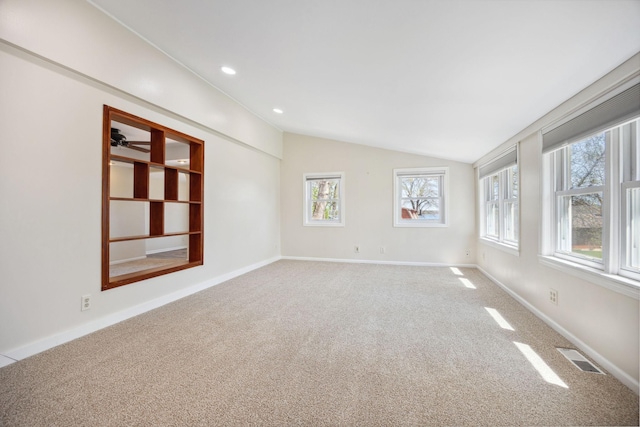 19797 612th Ave, Litchfield, MN 55355 - spare room featuring lofted ceiling, carpet floors, baseboards, and a ceiling fan