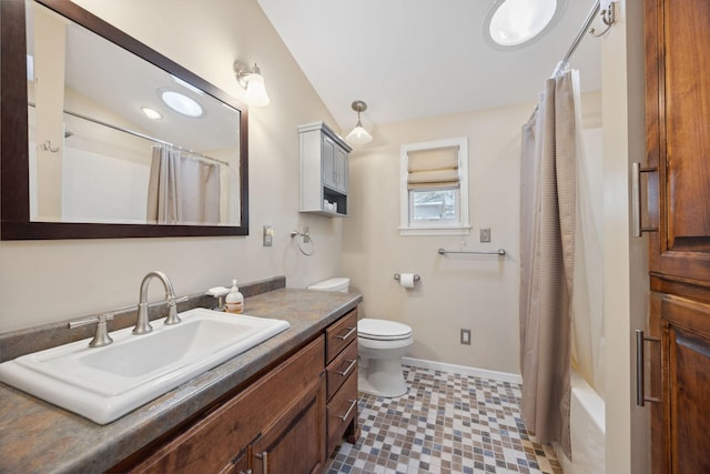 19797 612th Ave, Litchfield, MN 55355 - bathroom with toilet, baseboards, vanity, lofted ceiling, and tile patterned floors