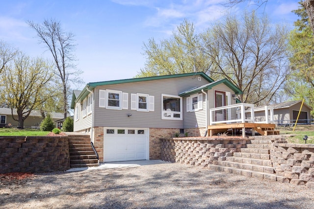 19797 612th Ave, Litchfield, MN 55355 - view of front of home with stairs, an attached garage, driveway, and a wooden deck
