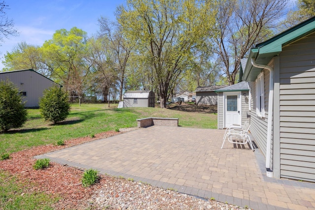 19797 612th Ave, Litchfield, MN 55355 - view of patio / terrace with entry steps and an outbuilding