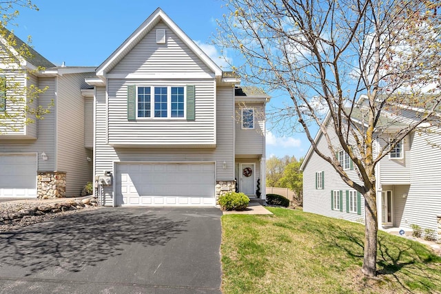 view of front facade with asphalt driveway, an attached garage, stone siding, and a front lawn