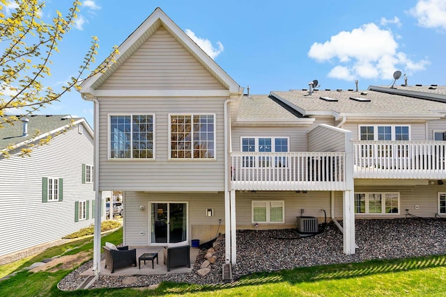 back of house featuring central AC unit and a patio area