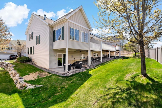 rear view of property featuring a patio area