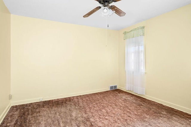 unfurnished room featuring a ceiling fan, baseboards, carpet flooring, and visible vents