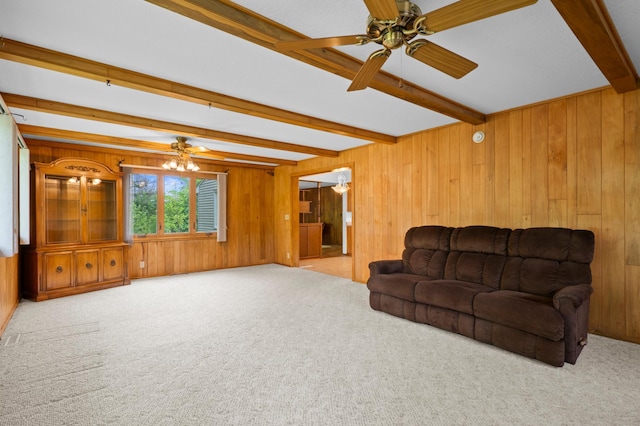 615 9th Ave SW, Faribault, MN 55021 - carpeted living room featuring beam ceiling, wood walls, and ceiling fan