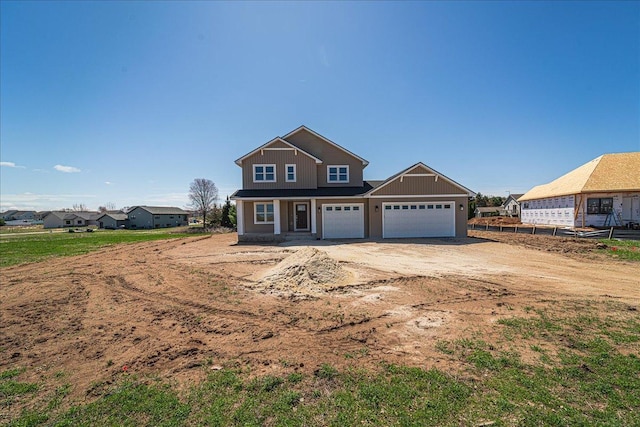 craftsman-style house featuring fence, an attached garage, and driveway