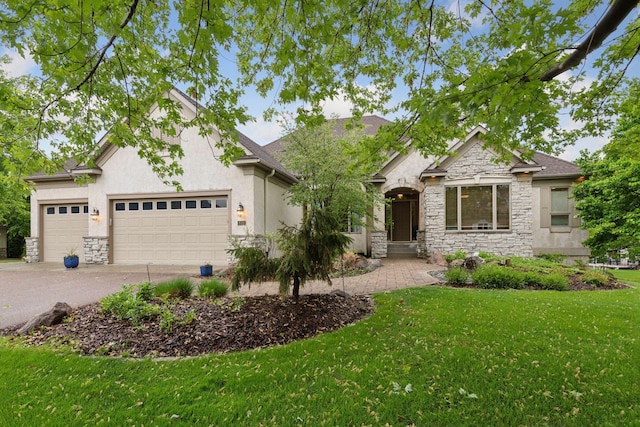 809 Saint Moritz, Victoria, MN 55386 - view of front facade featuring stone siding, a front yard, concrete driveway, an attached garage, and stucco siding