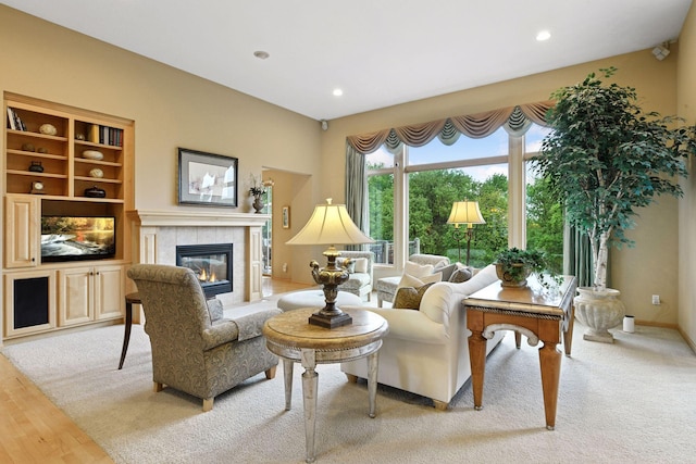 809 Saint Moritz, Victoria, MN 55386 - living area featuring a tiled fireplace, recessed lighting, and wood finished floors