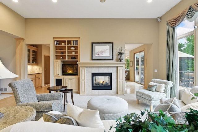 809 Saint Moritz, Victoria, MN 55386 - living area with a tile fireplace, recessed lighting, and light wood-style floors