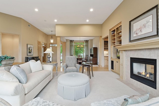 809 Saint Moritz, Victoria, MN 55386 - living room with recessed lighting, light colored carpet, built in shelves, and a tiled fireplace