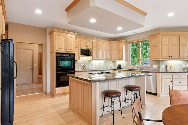 809 Saint Moritz, Victoria, MN 55386 - kitchen featuring black appliances, light brown cabinetry, a sink, a kitchen breakfast bar, and recessed lighting